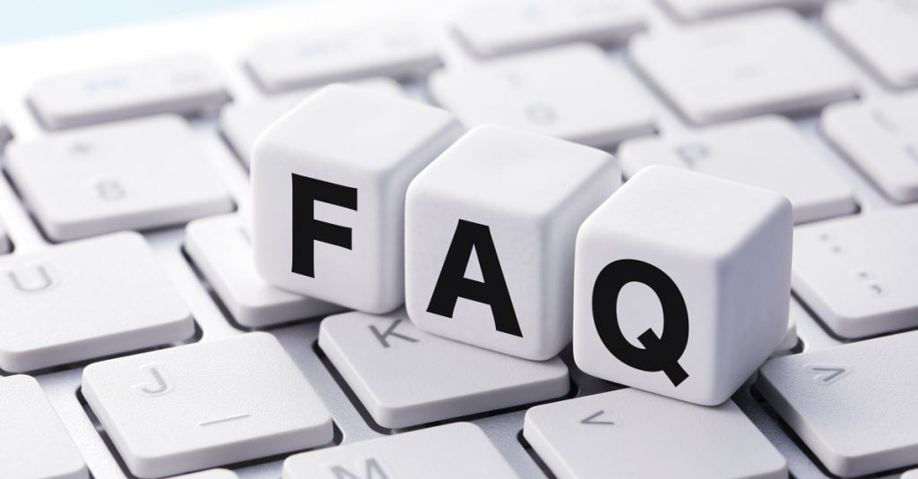 White Blocks With Black Writing That Says FAQ On A White Keyboard | Business Accounting