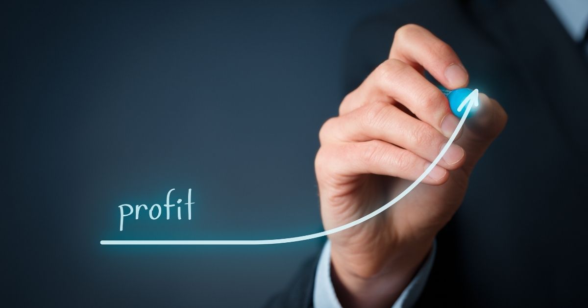 Man Drawing A Line Showing Increasing Profits | How To Make Your Business More Profitable
